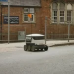 Starship robot crossing at traffic lights