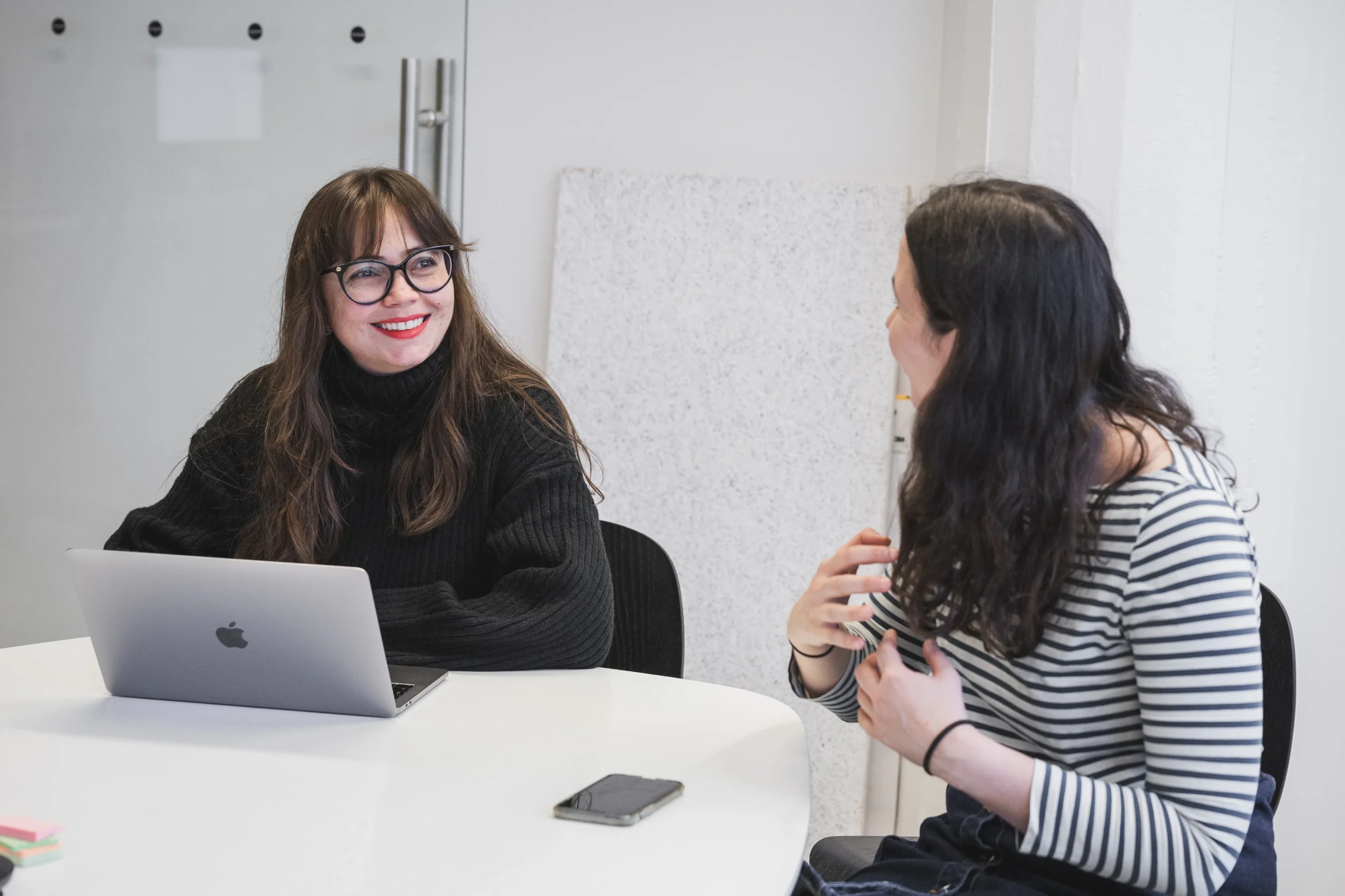 Two Starship employees having a meeting in an office