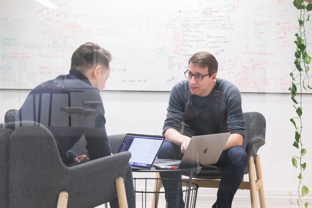 Two Starship employees having a meeting in an office